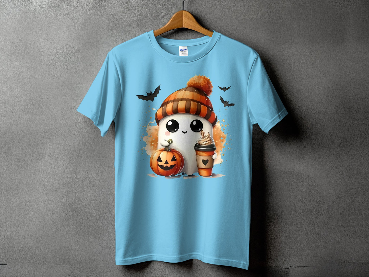 Light blue t-shirt with ghost, pumpkin, coffee cup, and bats Halloween graphic.