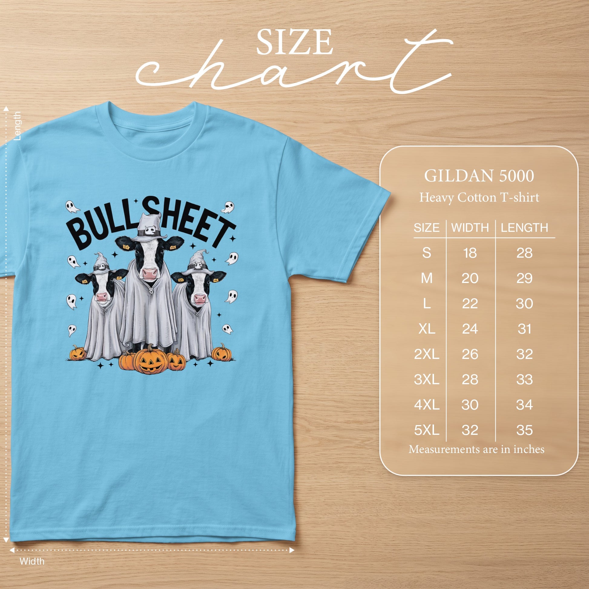 Light blue t-shirt with ghost cows and pumpkins design and Gildan 5000 size chart.