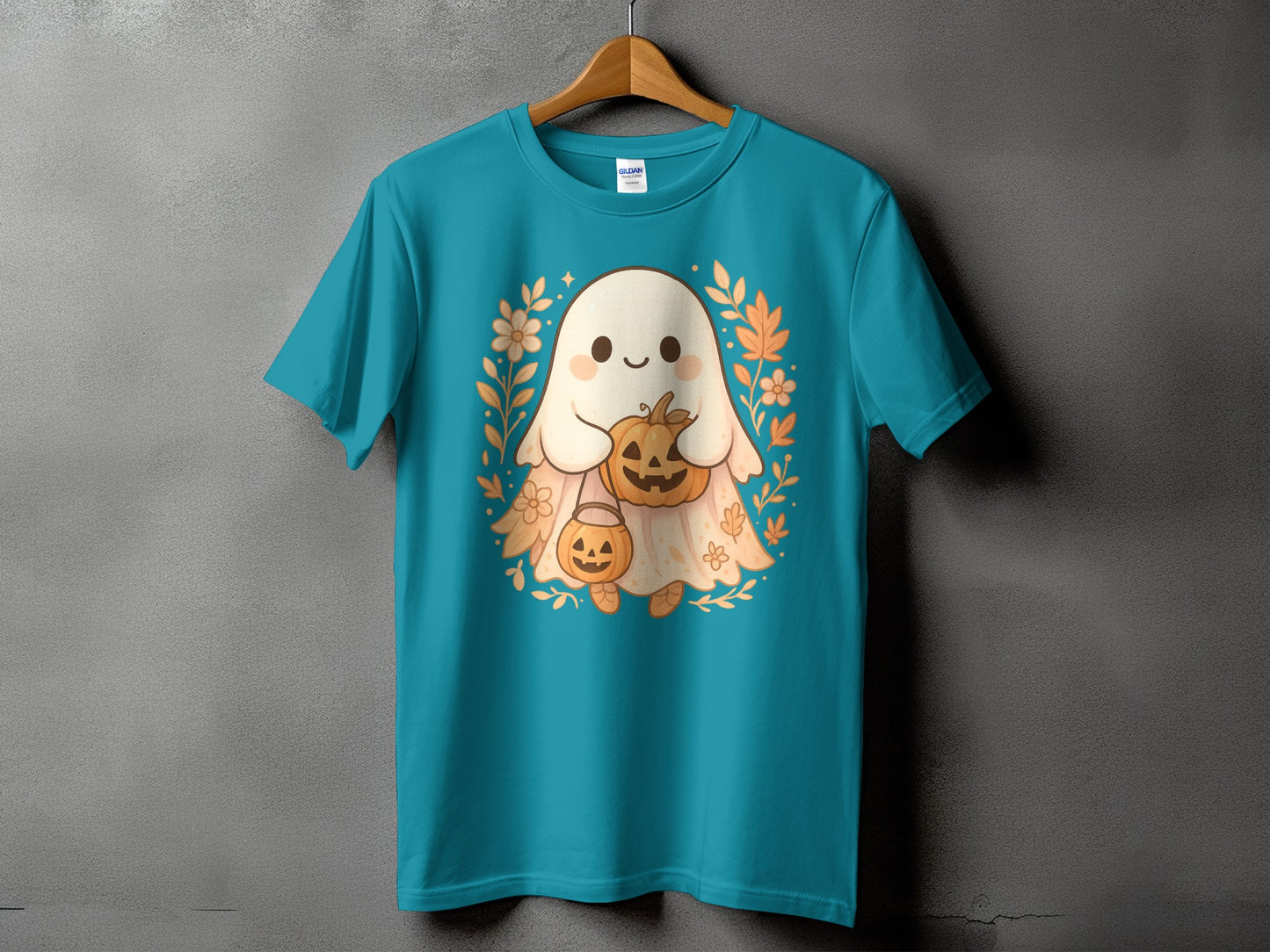 Teal t-shirt featuring a cute ghost holding pumpkins with floral accents.