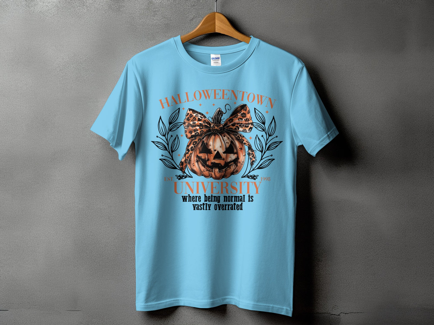Light blue t-shirt with Halloween town university graphic.