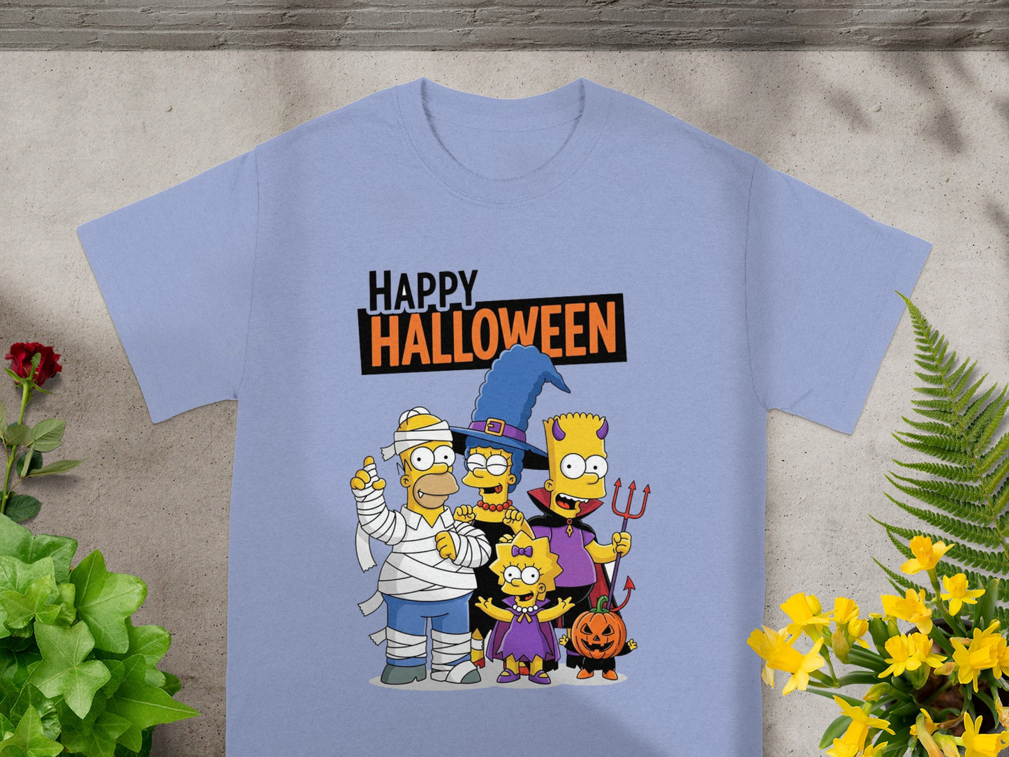 The Simpsons characters in Halloween costumes with text Happy Halloween.