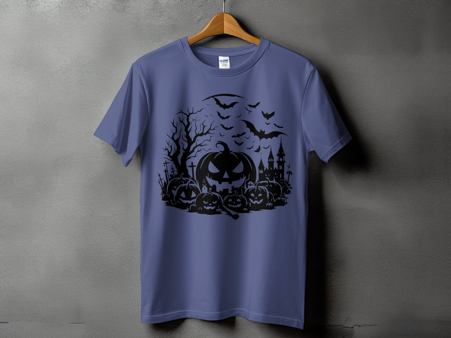 Purple t-shirt with black Halloween graphic of pumpkins, bats, haunted house, and a bare tree.