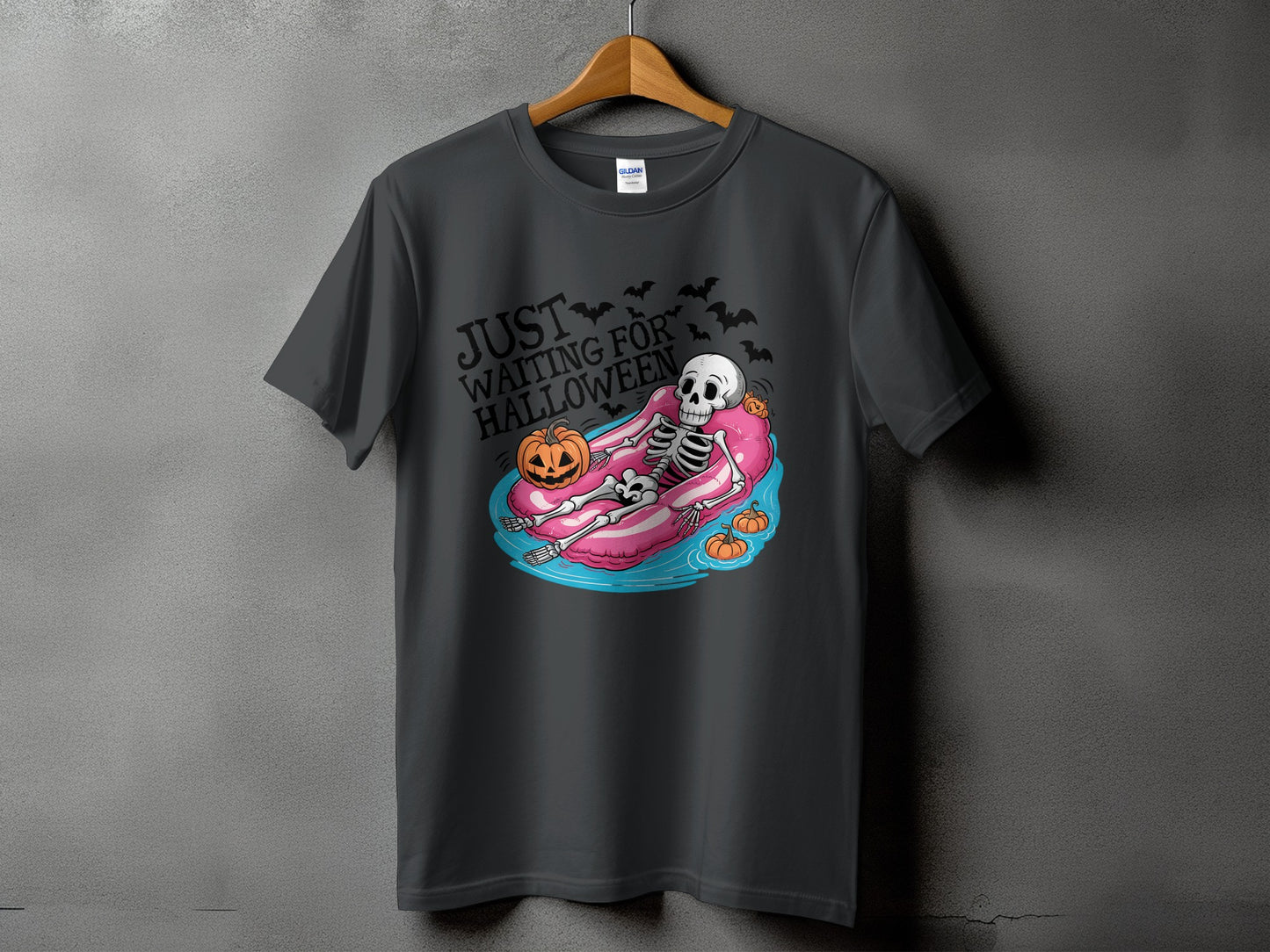 Dark grey t-shirt with skeleton on float and "Just Waiting For Halloween" text.