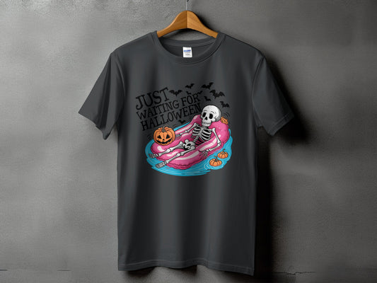 Dark grey t-shirt with skeleton on float and "Just Waiting For Halloween" text.