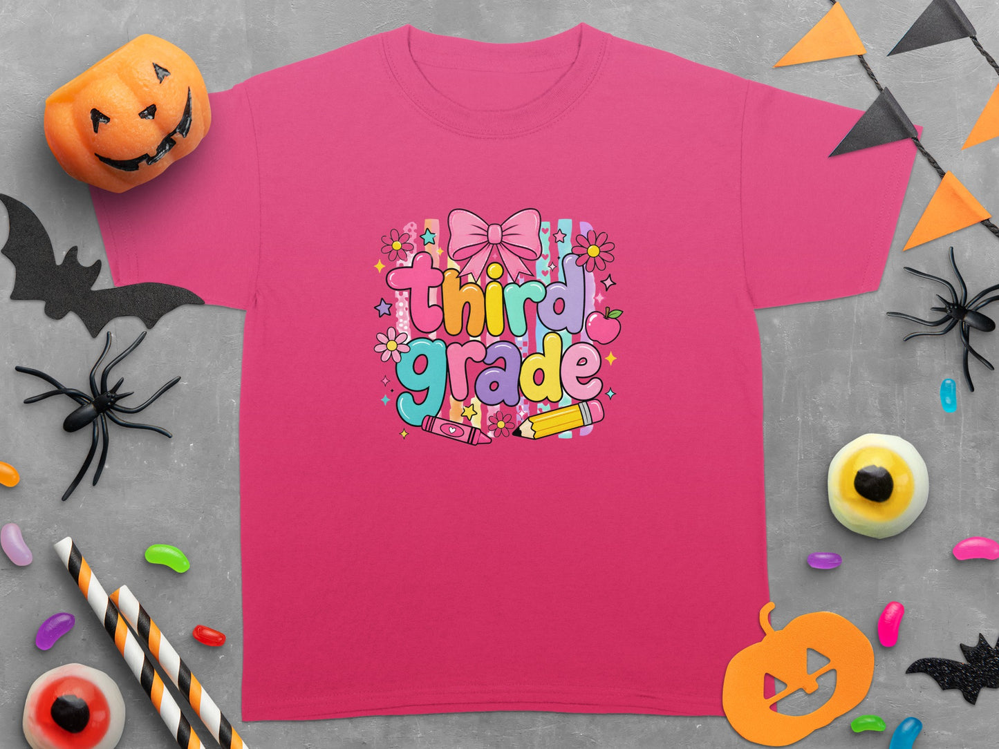 Pink t-shirt with "Third Grade" text, bow, flowers, and school supplies.