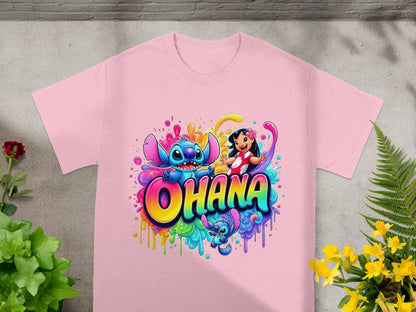 Pink t-shirt with Stitch and Lilo surrounded by colorful paint splatters.