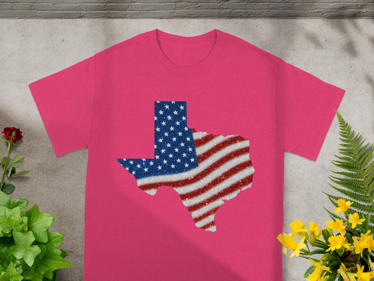 Pink t-shirt with Texas shape filled with glittery American flag design.
