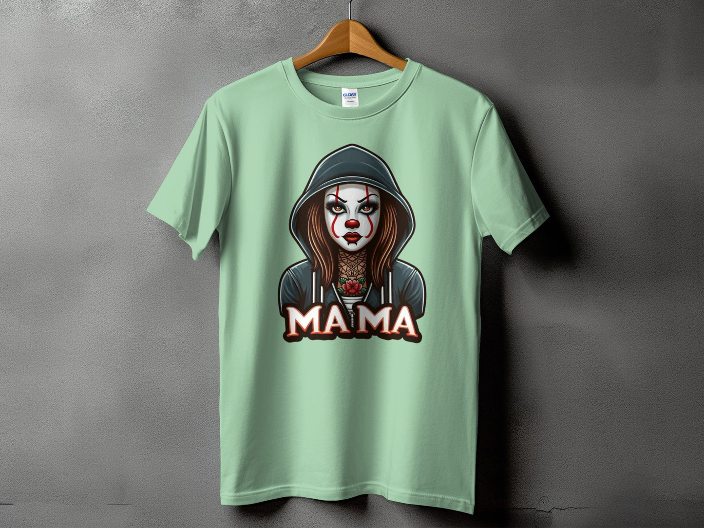 Light green t-shirt with a graphic of a clown-like woman and the word "MAMA".