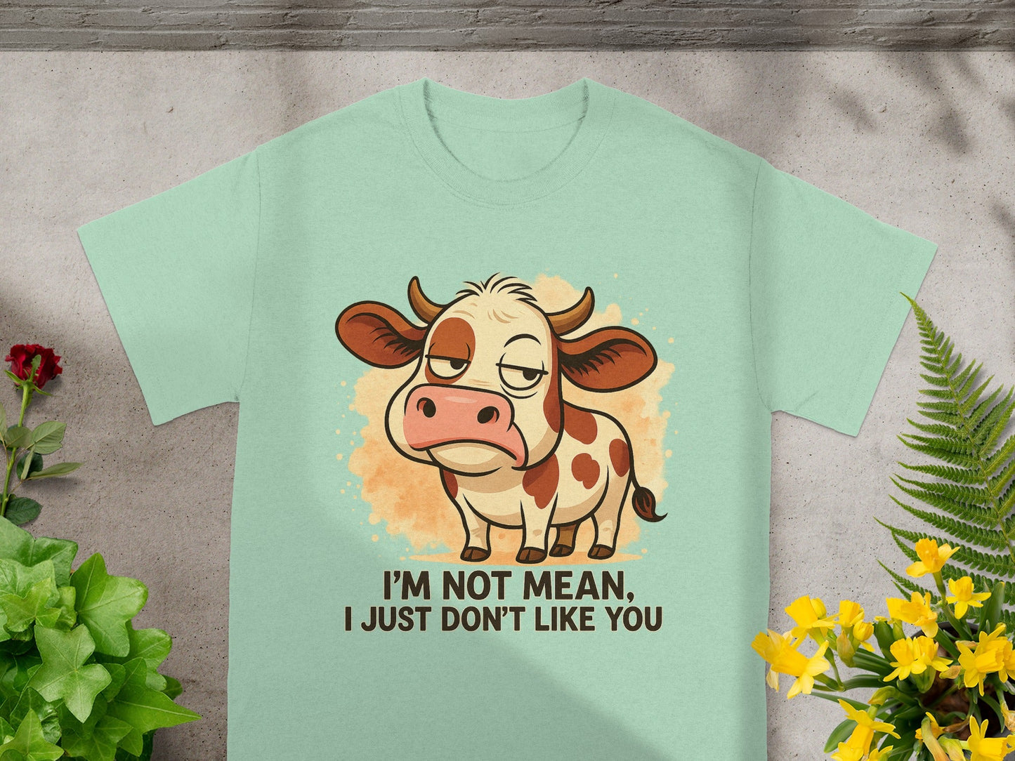 Mint green t-shirt with cartoon cow and text "I'M NOT MEAN, I JUST DON'T LIKE YOU".