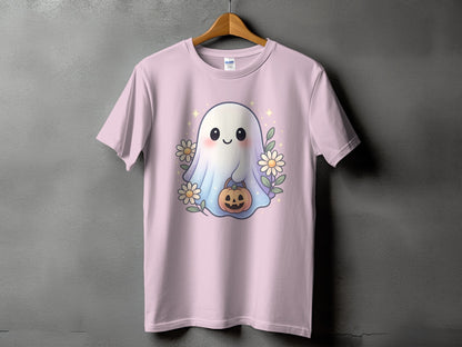 Pink t-shirt with a cute ghost holding a pumpkin, surrounded by flowers and sparkles.