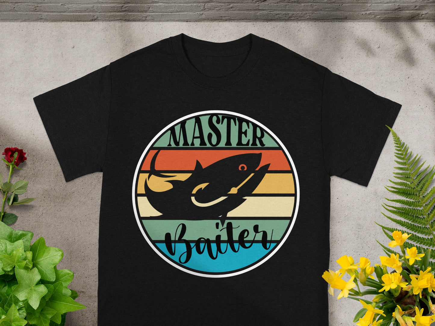 Black t-shirt with a vintage circle graphic of a fish and text "Master Baiter".