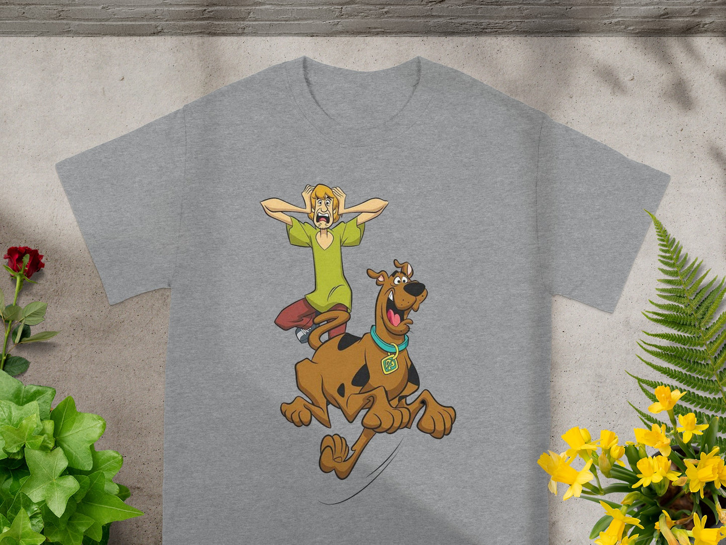 Scooby-Doo and Shaggy running in terror on a gray t-shirt.