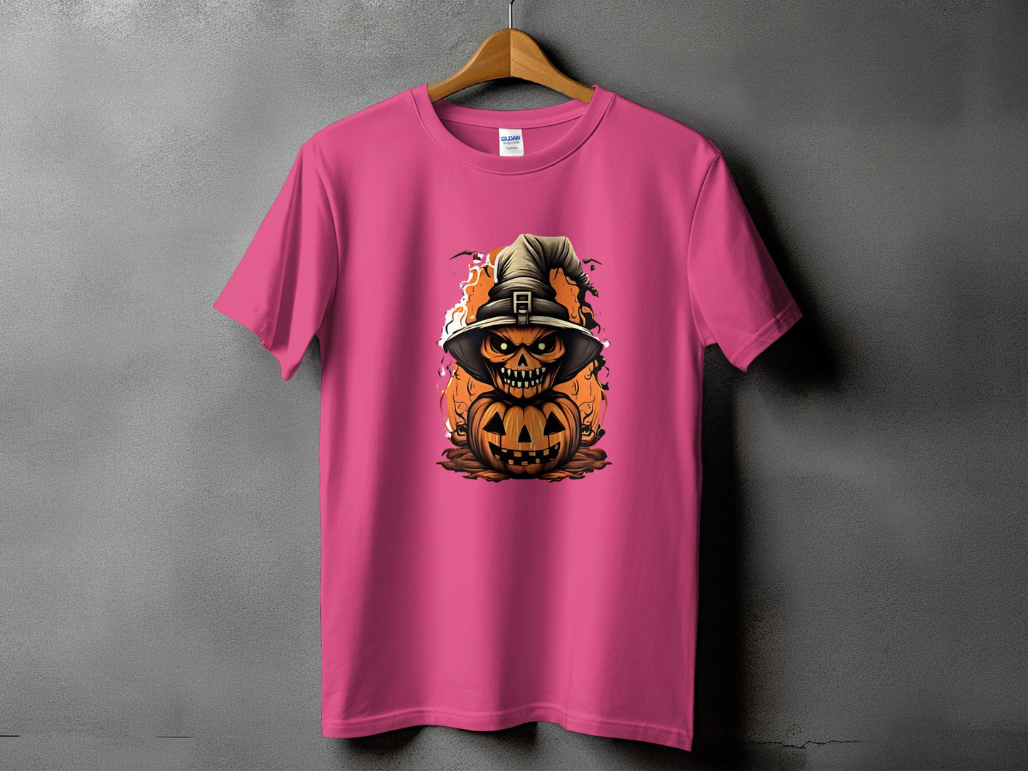 Pink t-shirt with a jack-o'-lantern wearing a witch hat and flames.