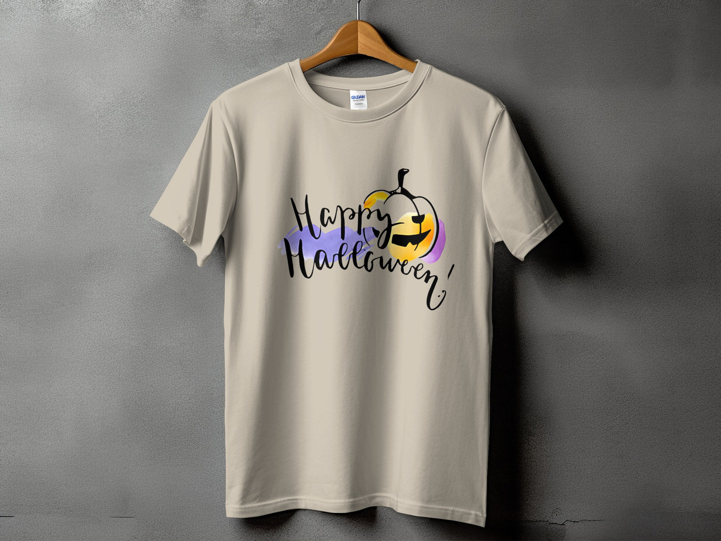 Light tan t-shirt with "Happy Halloween" text and a watercolor pumpkin graphic.