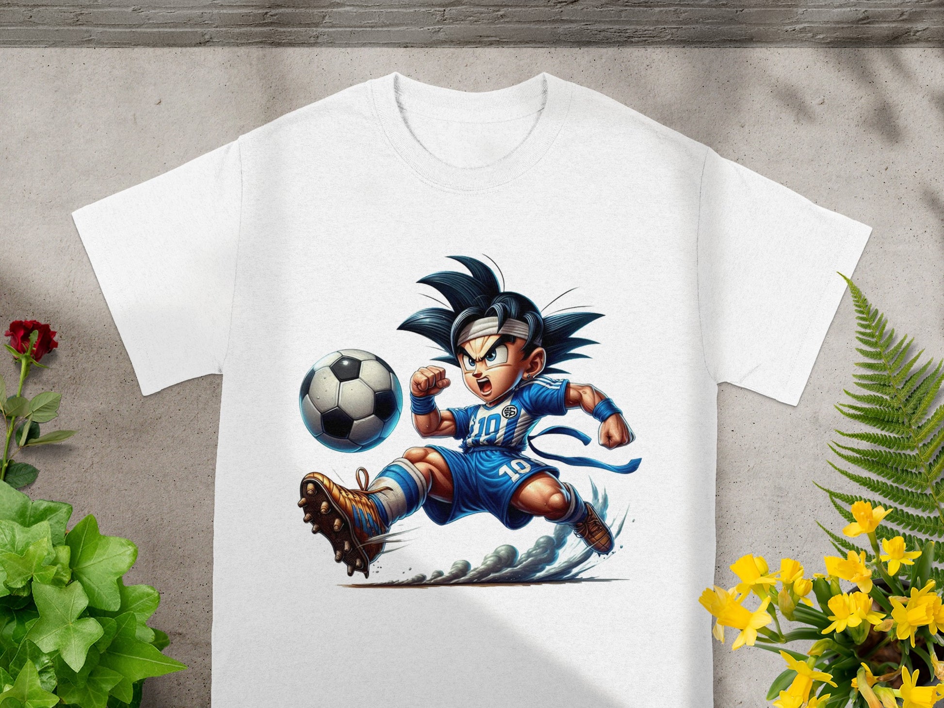 Goku character in soccer uniform kicking a ball, front of white t-shirt.