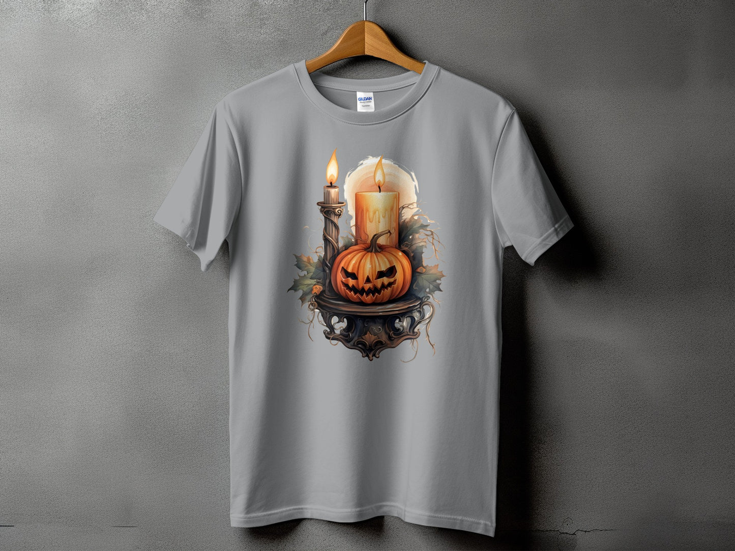 Halloween t-shirt with carved pumpkin and lit candles on a stand.