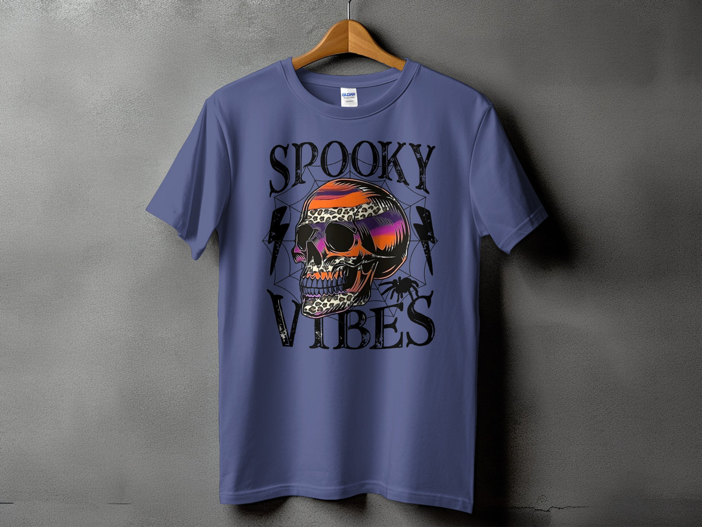 Purple t-shirt with "Spooky Vibes" text and a colorful skull graphic.