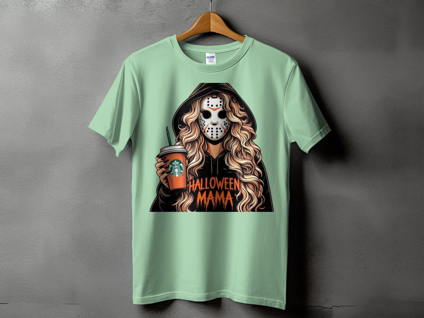 T-shirt graphic with woman in hockey mask holding coffee cup, text Halloween Mama.