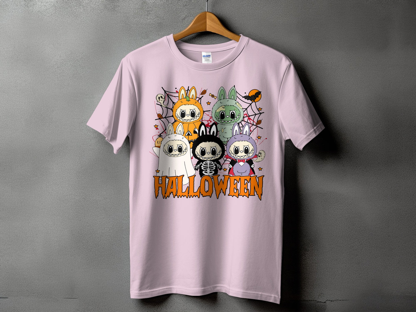 Pink t-shirt with five cute Halloween characters and the word "HALLOWEEN" below.