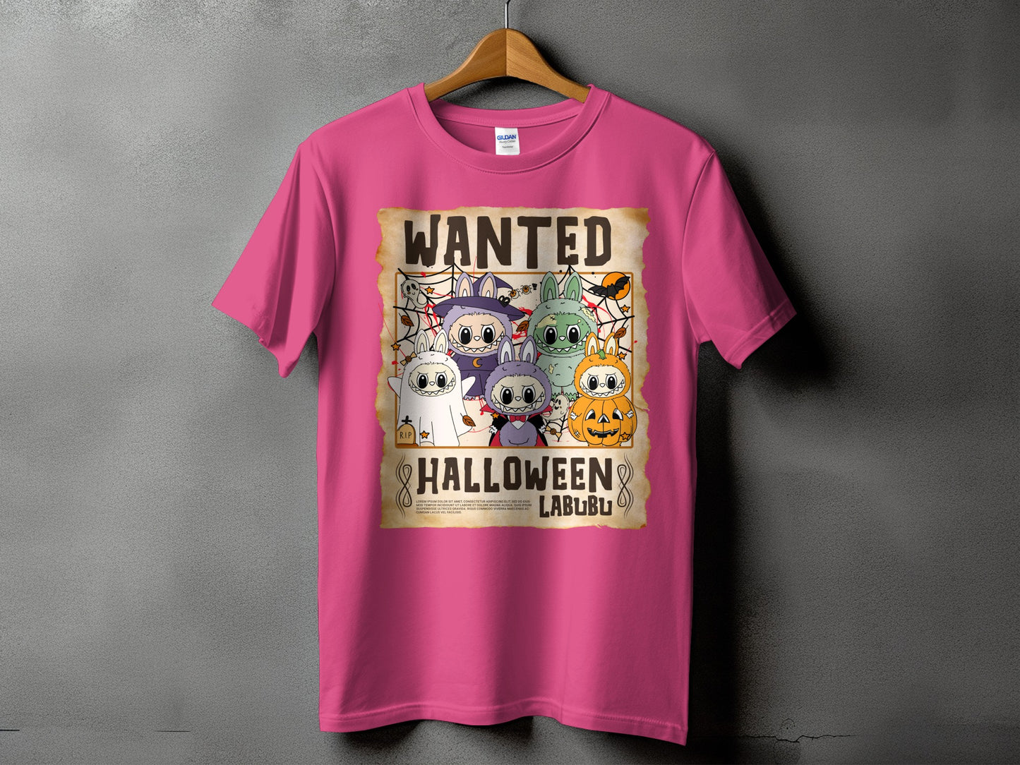 Pink t-shirt with a wanted poster featuring cartoon Halloween characters and the text "Wanted Halloween Labubu".