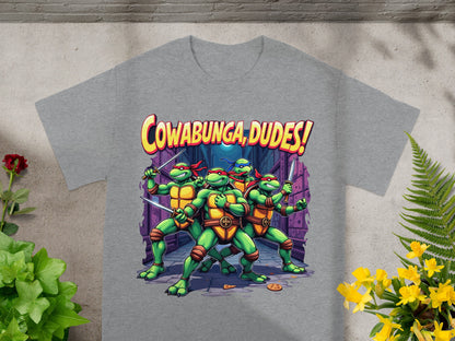 Teenage Mutant Ninja Turtles pose with swords and text "Cowabunga, Dudes!".