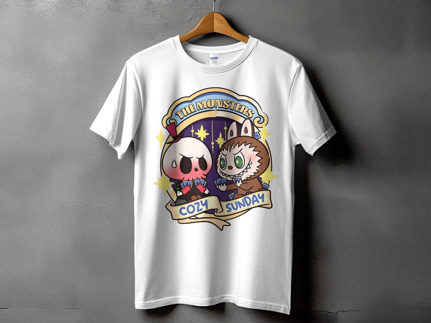 White t-shirt with cartoon skull and monster characters playing cards, reading "The Monsters Cozy Sunday".
