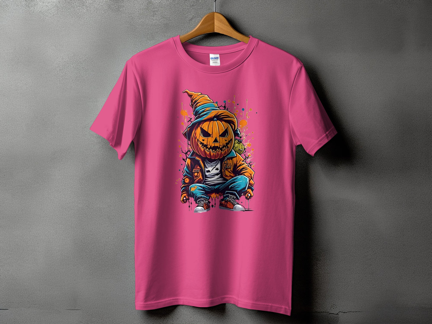 Pink t-shirt with a cartoon jack-o'-lantern wearing a hat and jacket.