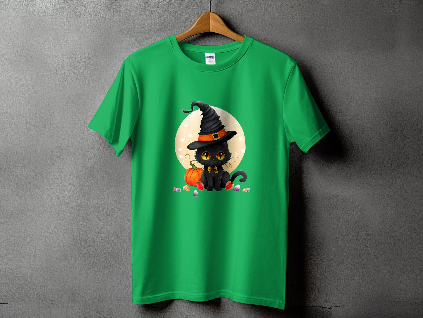 Green t-shirt with a Halloween graphic of a black cat in a witch hat.