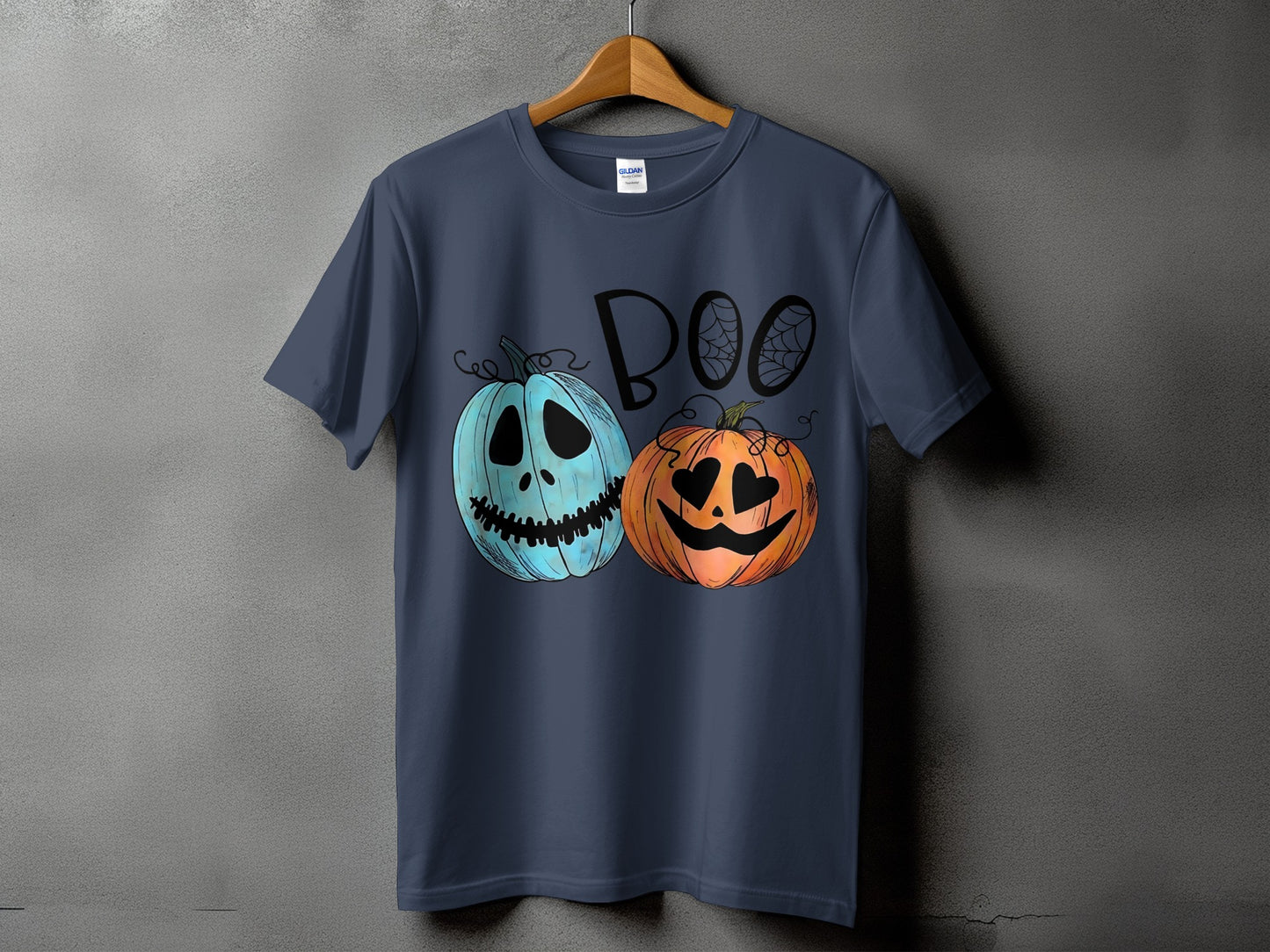 Dark blue t-shirt with two pumpkins and the word "Boo" with spider webs.