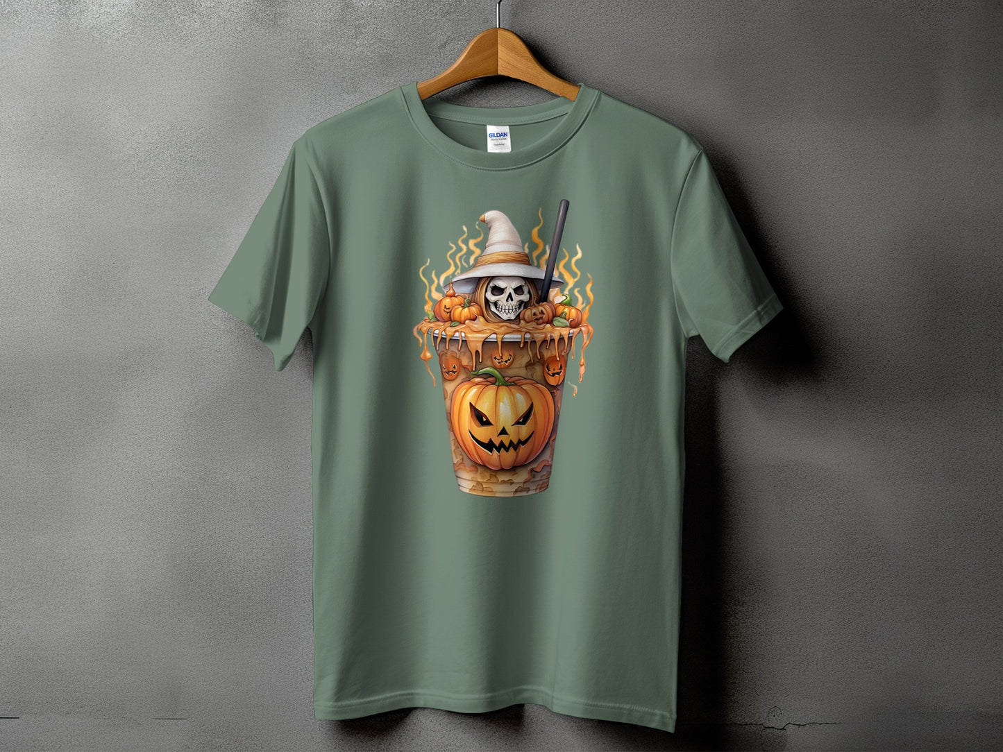 Green t-shirt with a Halloween-themed graphic of a skull in a witch hat and pumpkins.