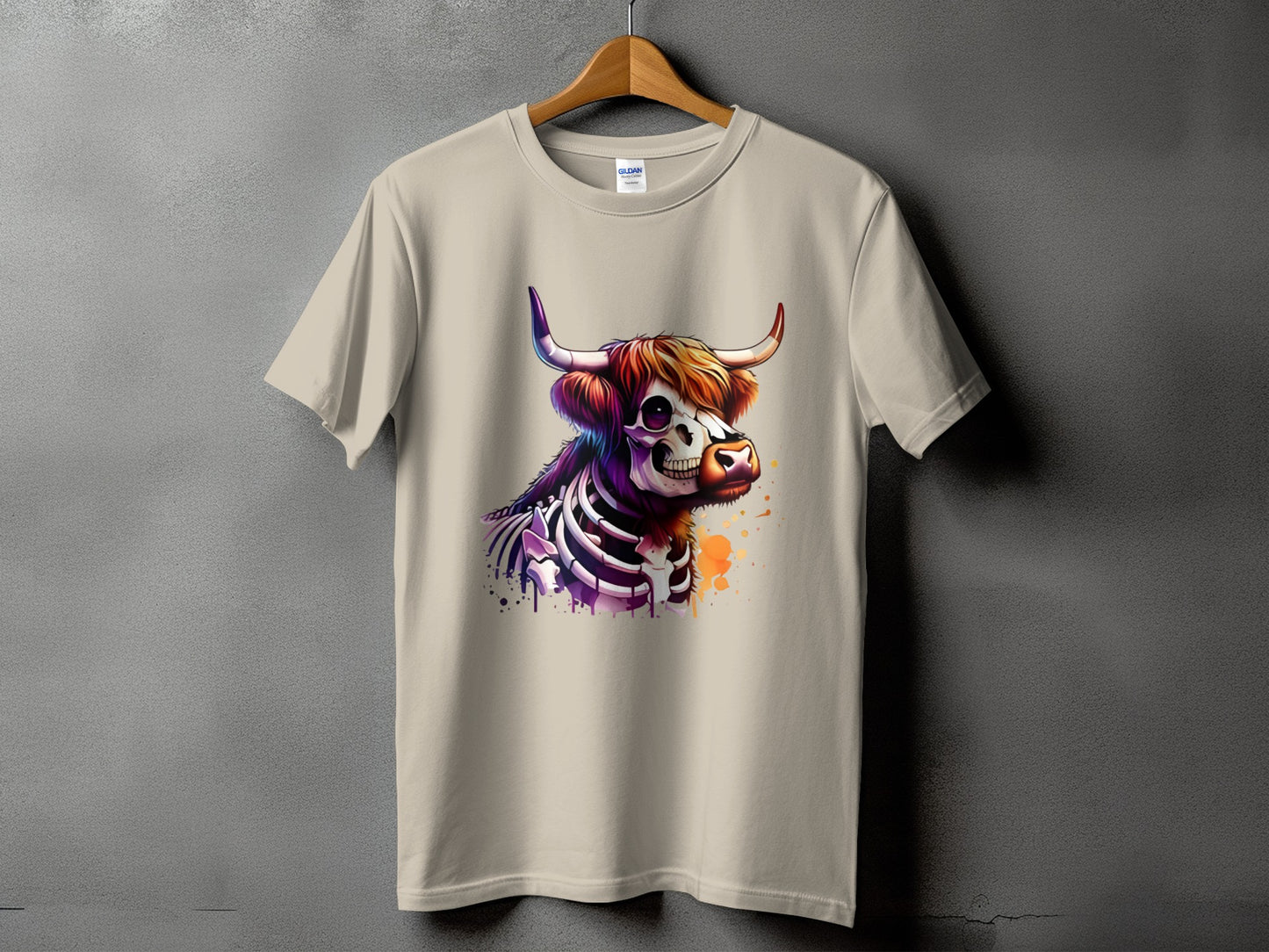 T-shirt with a colorful skeletal Highland cow graphic and watercolor splatter.