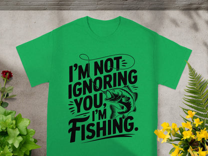 Green t-shirt with black text and fish graphic: "I'M NOT IGNORING YOU, I'M FISHING."
