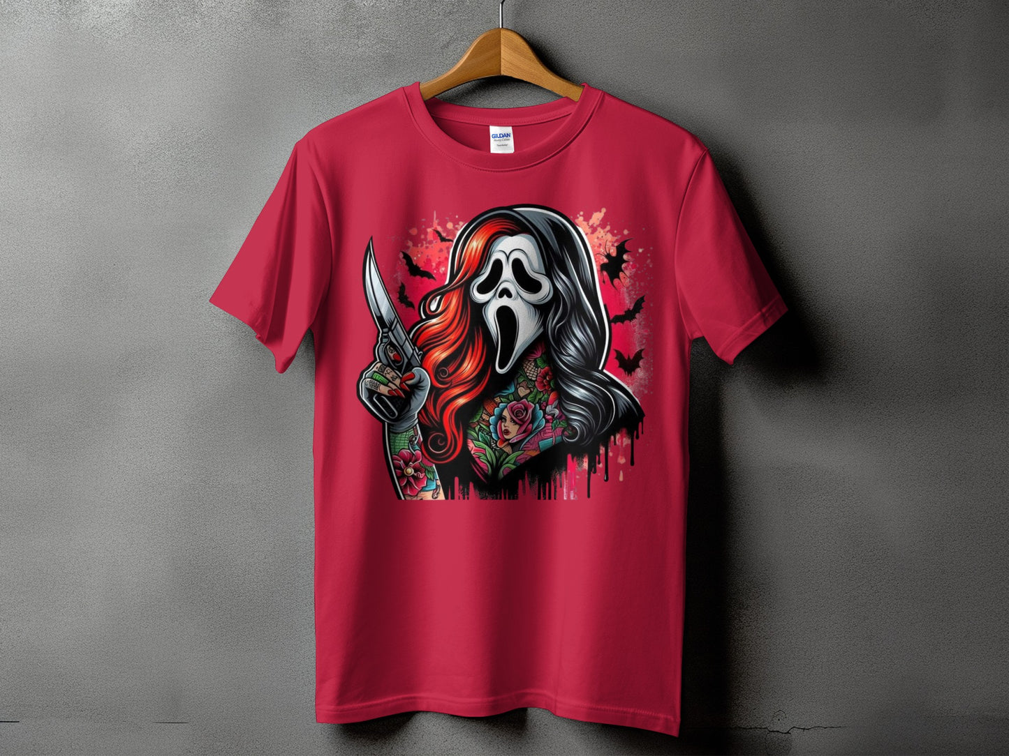 Red t-shirt with a tattoo-style graphic of a masked figure holding a knife.