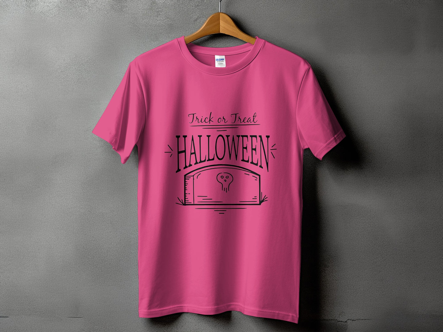 Pink t-shirt with "Trick or Treat Halloween" text and a skull on a tombstone graphic.