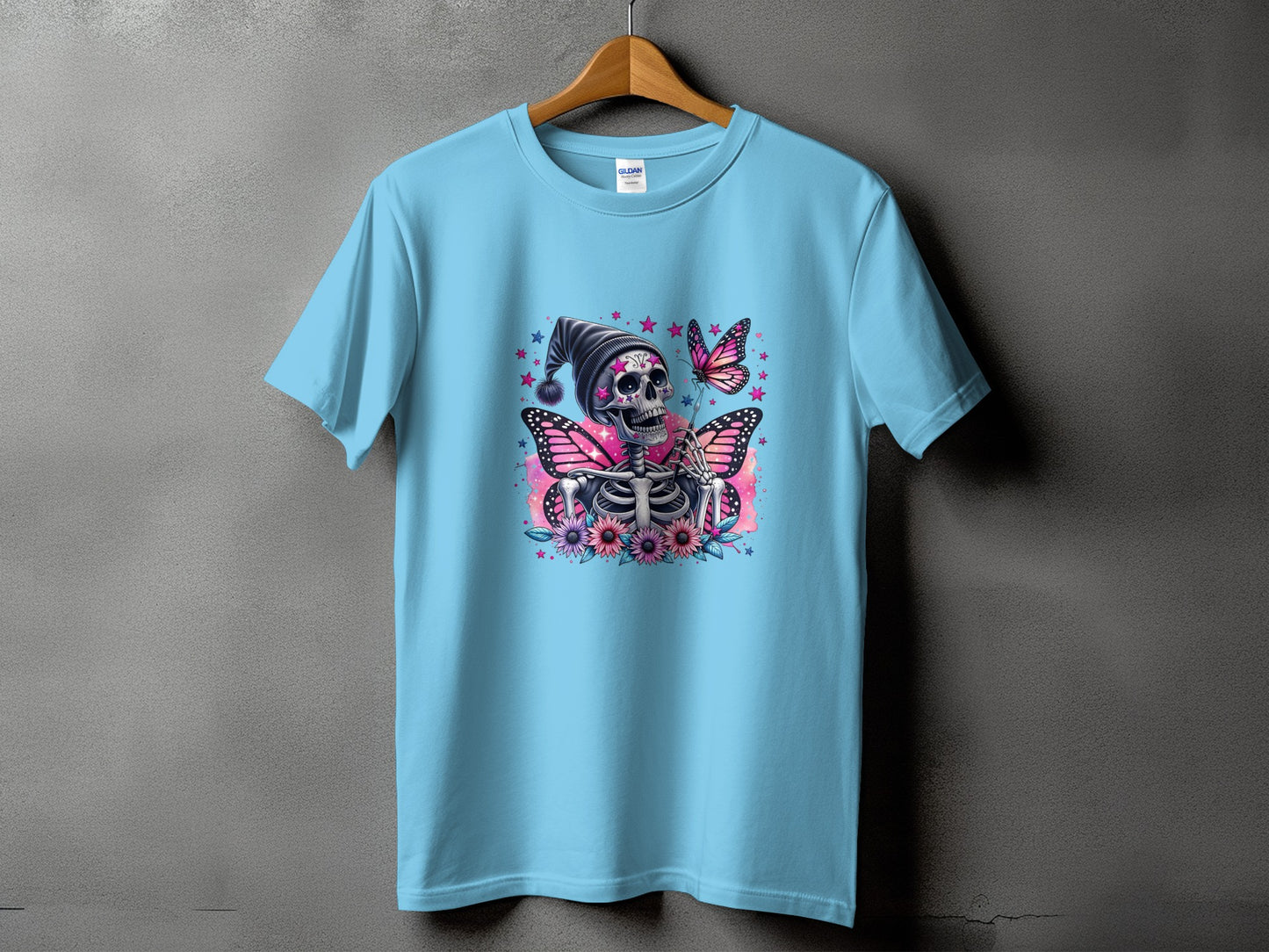 Light blue t-shirt with skeleton, butterfly, and flower graphic.
