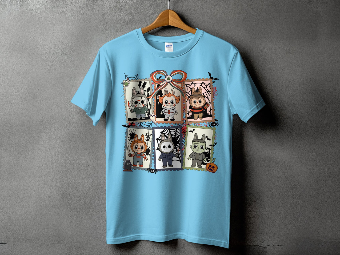 Light blue t-shirt with six horror characters framed as postage stamps.