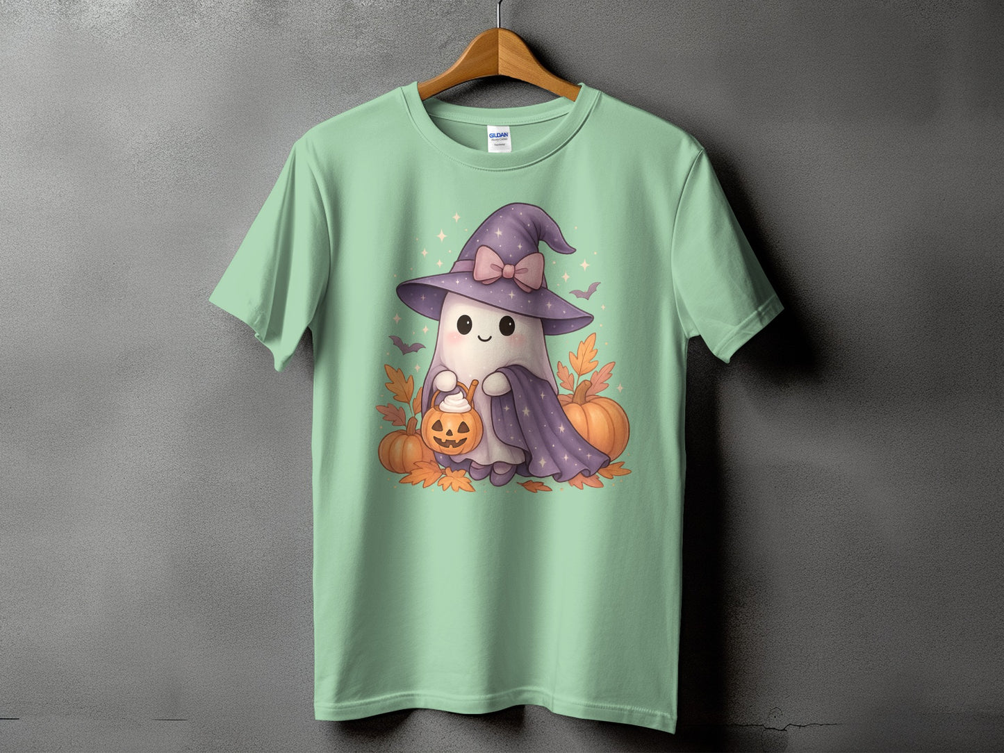 Mint t-shirt with a cute ghost holding a pumpkin trick-or-treat bucket.