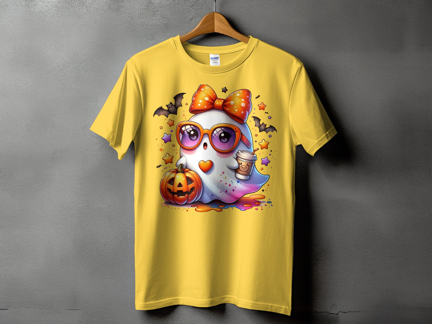 Yellow t-shirt featuring a cute ghost with sunglasses, bow, coffee, and pumpkin.