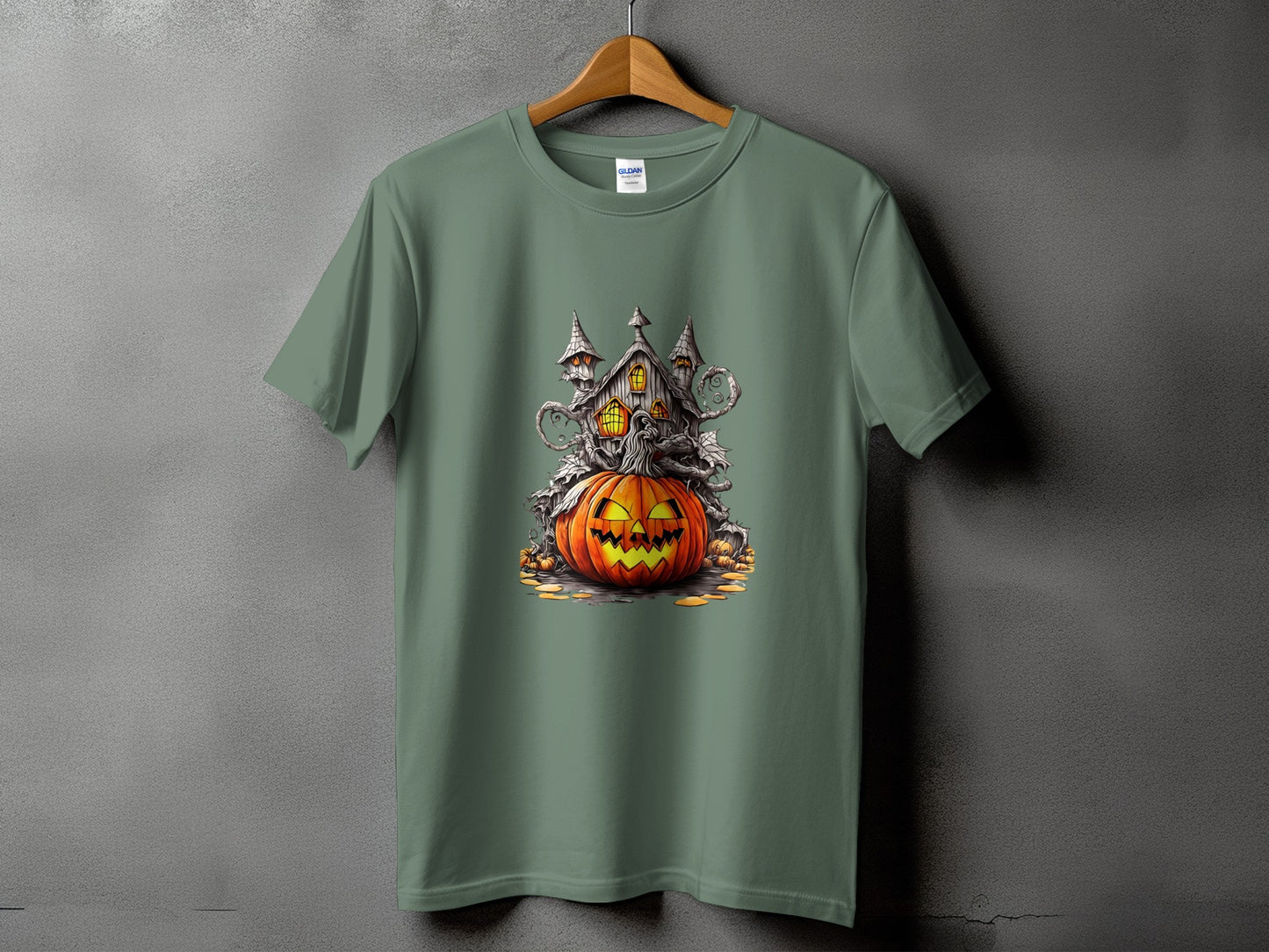 Green t-shirt featuring a jack-o'-lantern and haunted house Halloween graphic.