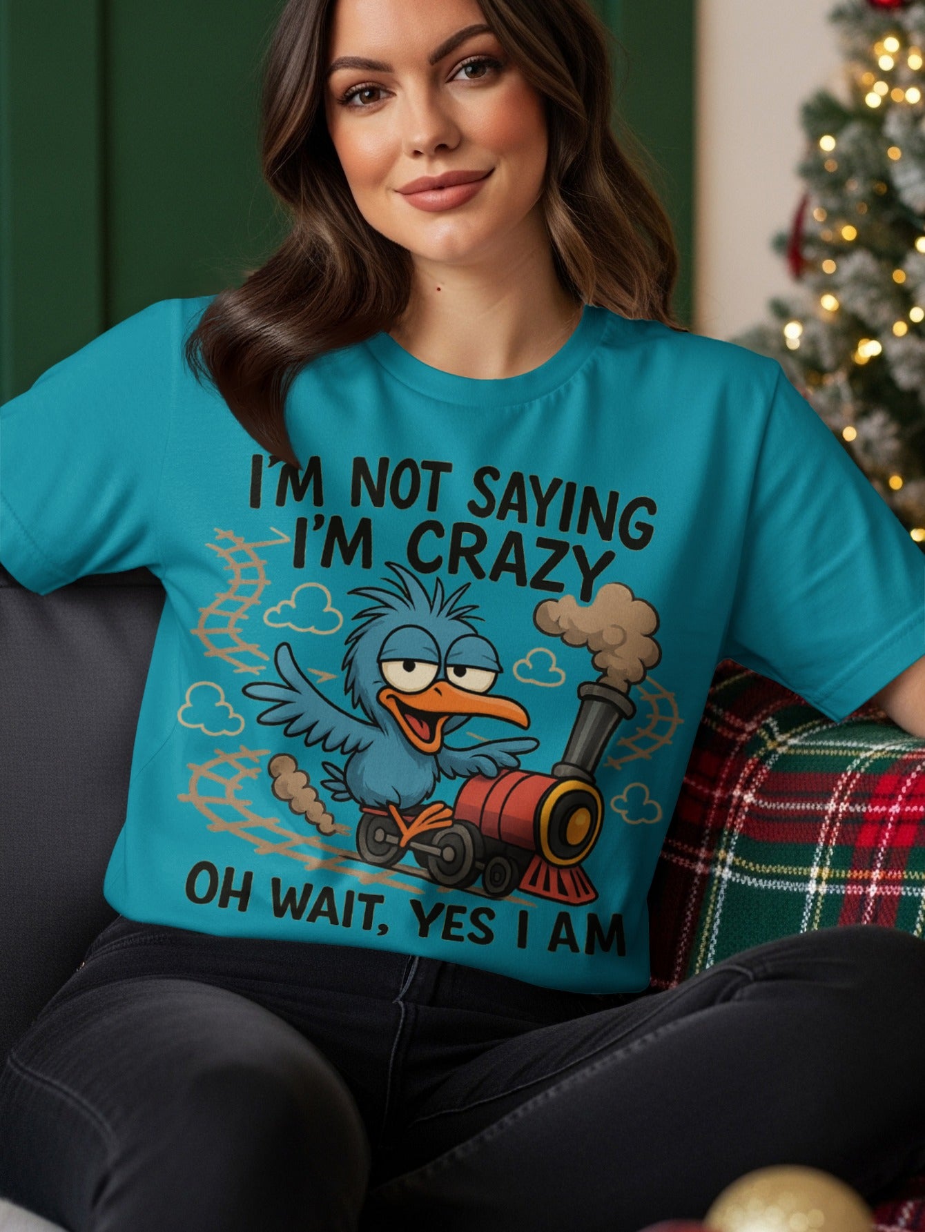 Blue t-shirt with a cartoon bird and train graphic, reading "I'm not crazy I'm saying OH WAIT YES I AM".