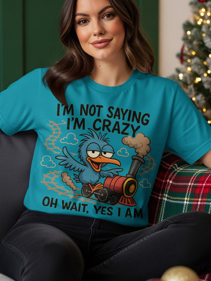 Blue t-shirt with a cartoon bird and train graphic, reading "I'm not crazy I'm saying OH WAIT YES I AM".
