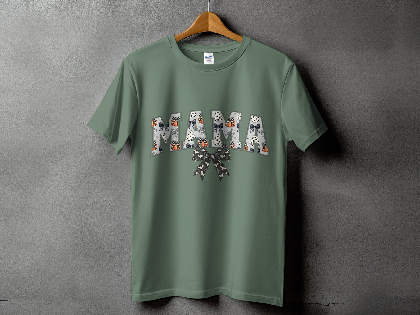 Green t-shirt with "MAMA" text in a Halloween-themed font.