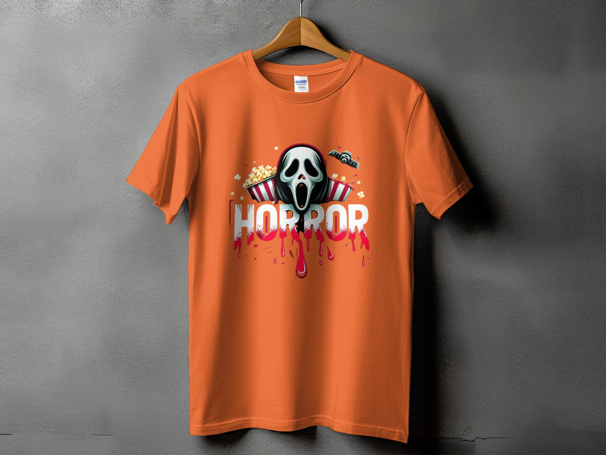 Orange t-shirt with a screaming ghost mask, popcorn, and the word "HORROR".