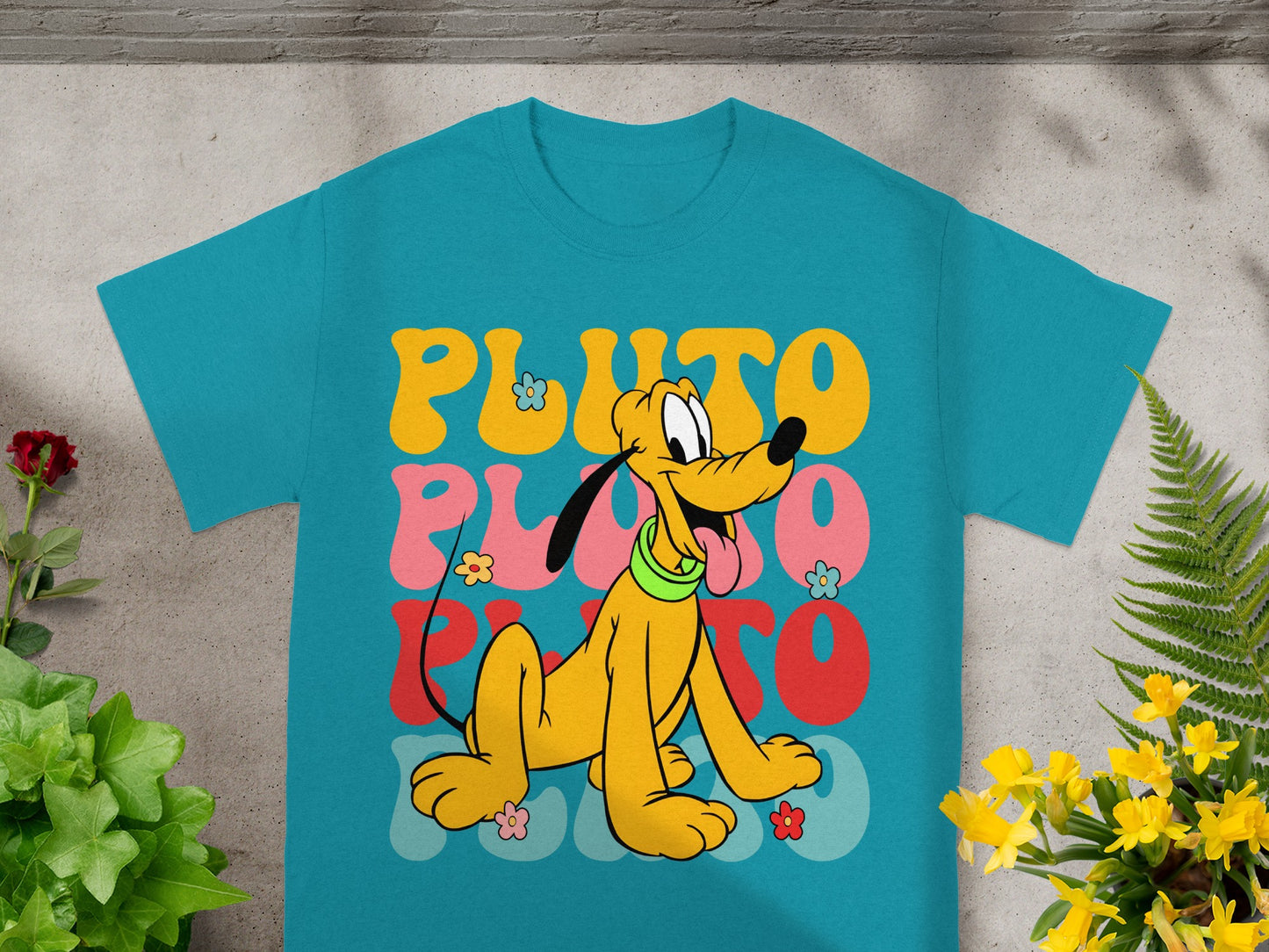 Turquoise t-shirt with Pluto character and colorful "Pluto" text.