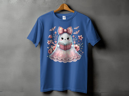 Blue t-shirt with a cute ghost reading a book surrounded by flowers and bats.
