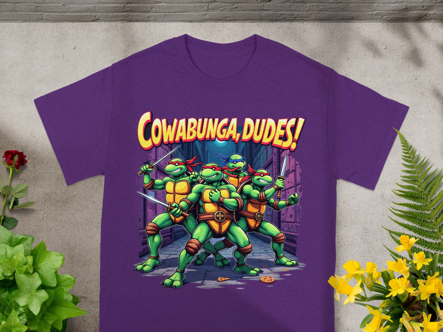 Purple t-shirt with Teenage Mutant Ninja Turtles and "Cowabunga Dudes!" text.