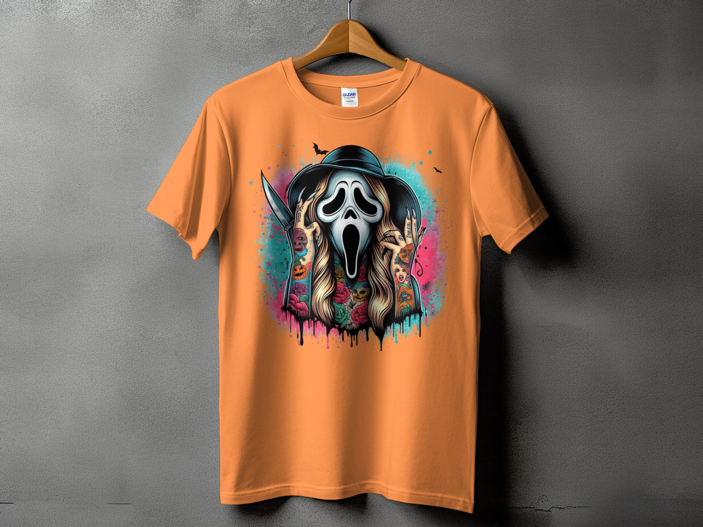 Orange t-shirt with Scream ghost mask, knife, tattoos, and bats graphic.