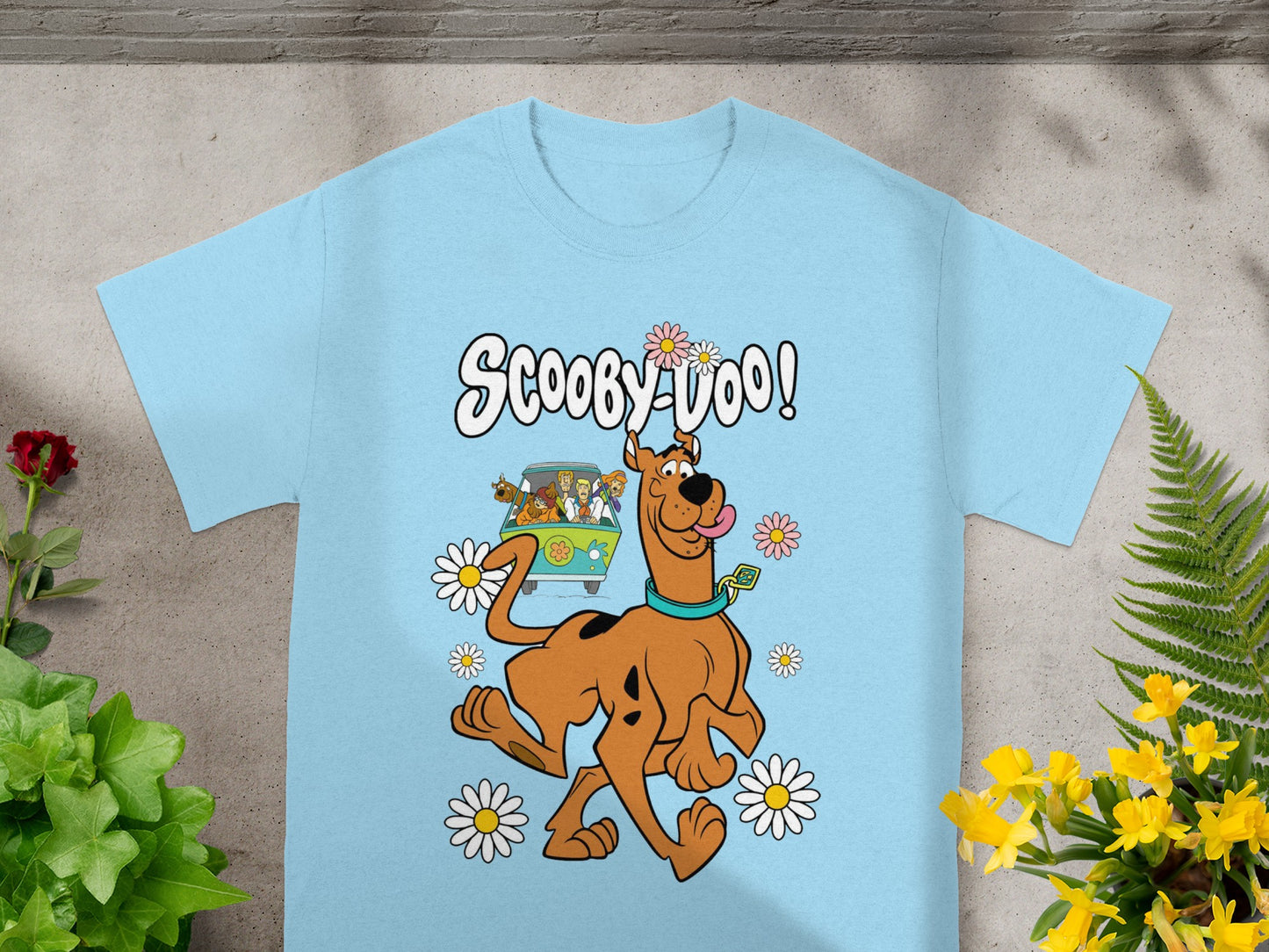 Light blue t-shirt with Scooby-Doo text and characters surrounded by daisies.