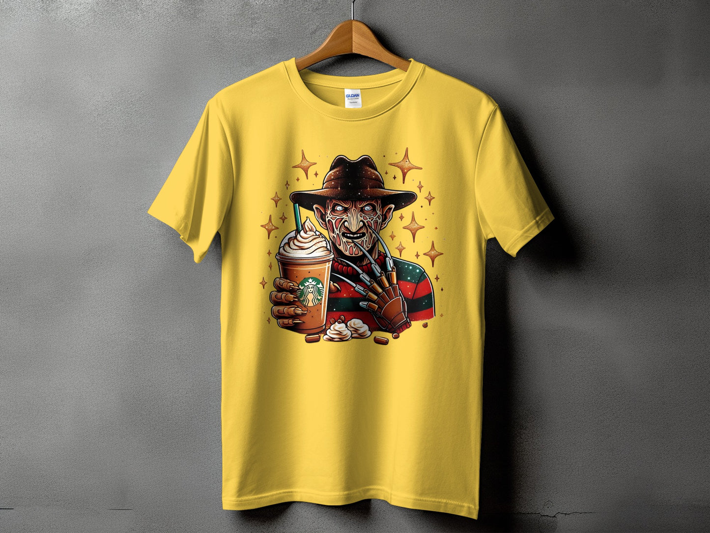 Yellow t-shirt with Freddy Krueger holding a Starbucks drink and candy.
