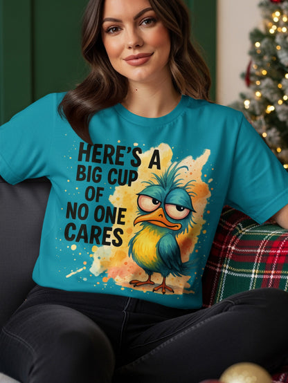 Teal t-shirt with a grumpy bird and "Here's a big cup of no one cares."